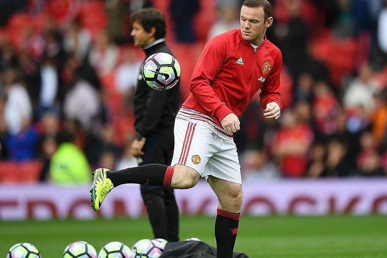 Wayne Rooney warming up before the game against Leicester. He last started for United in the 1-3 loss to Watford four weeks ago.