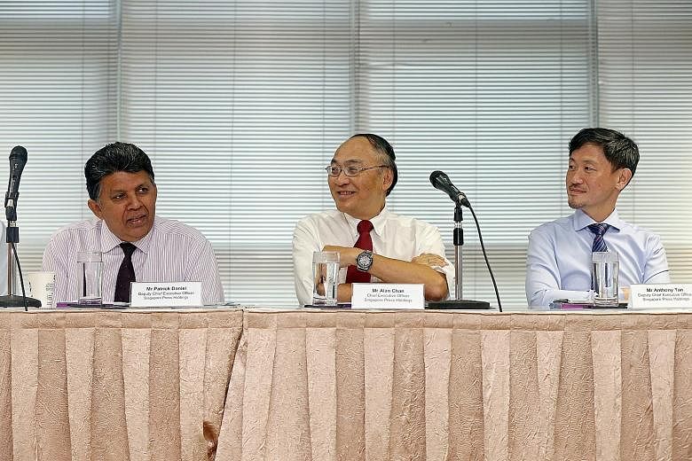 From left: Mr Patrick Daniel, deputy CEO, Mr Alan Chan, CEO, and Mr Anthony Tan, deputy CEO, of Singapore Press Holdings at the meeting announcing the group's full-year results at the SPH News Centre yesterday.