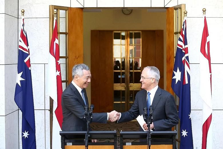 Prof Chan says as a small country, the principles are Singapore's best defence and win the Republic respect. Mr Lee met Mr Turnbull (right) in Australia last week and witnessed the inking of pacts to step up defence, trade, innovation and security ti
