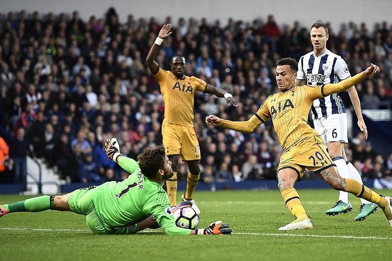 West Bromwich Albion goalkeeper Ben Foster makes a save from Tottenham's Dele Alli (No. 20). But Foster was beaten by the midfielder late in the game as the sides drew 1-1.