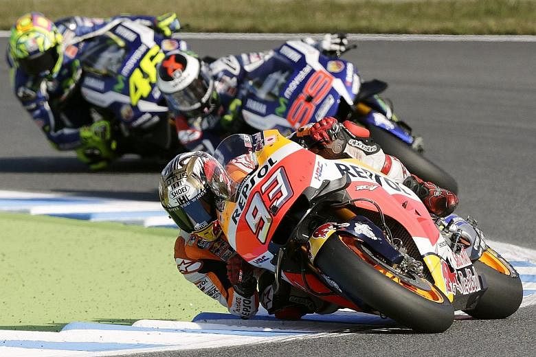 Above: Honda rider Marc Marquez, winner of the Japanese Grand Prix in Motegi, had never won at Honda's home circuit before yesterday's race. Left: Marquez leading Italian MotoGP Yamaha duo Valentino Rossi (left) and Jorge Lorenzo during the Japanese 