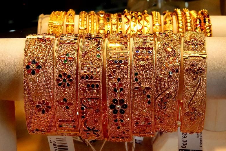 Gold jewellery on display at a shop in Singapore. The solution being assessed is to hold an earlier auction in London to set "pre-AM" prices at around 2pm Singapore time.