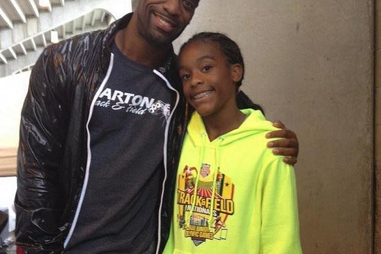 Olympic sprinter Tyson Gay with his daughter Trinity, who died after being caught in a shooting between two vehicles.