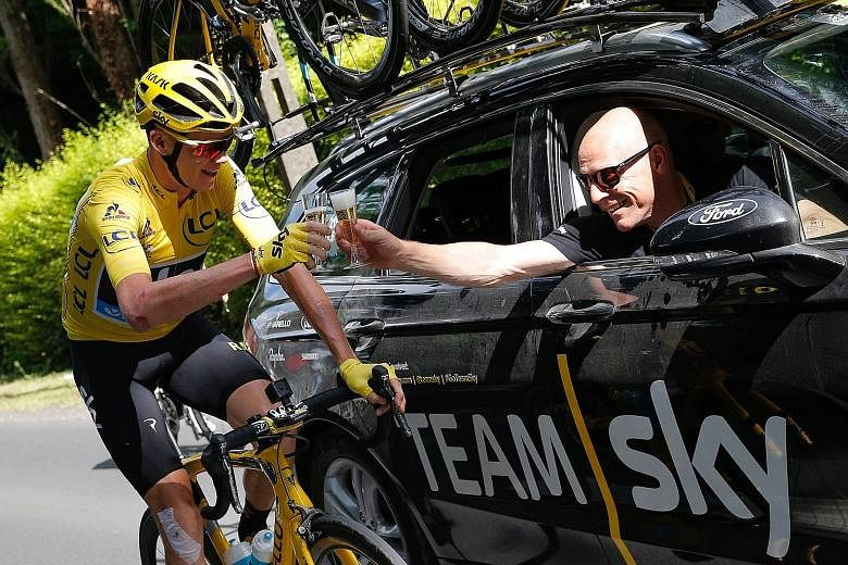 Chris Froome and Team Sky principal Dave Brailsford celebrating at this year's Tour de France. The British team have won four of the last five Tour de France titles.