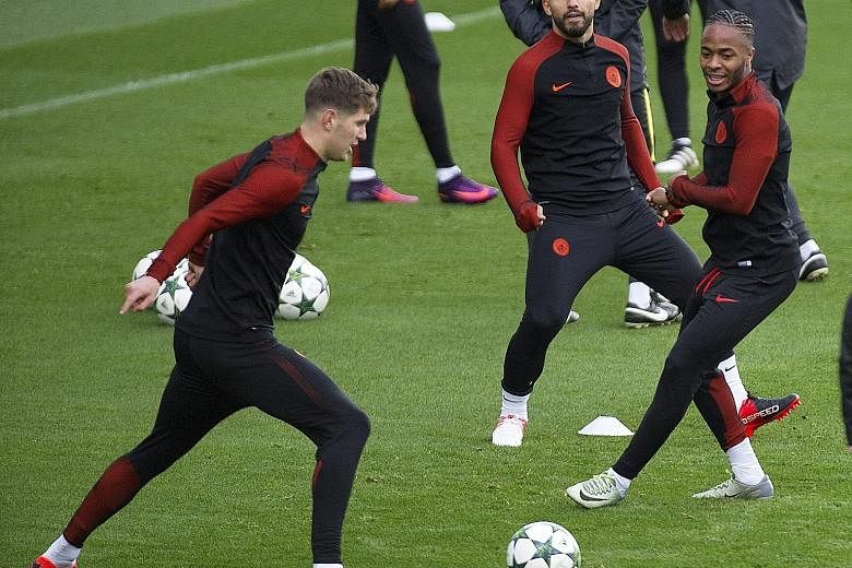Manchester City's Sergio Aguero (centre) training with John Stones (left) and Raheem Sterling (right) ahead of their Champions League clash against Barcelona at the Nou Camp. Striker Aguero is hopeful Argentina team-mate Lionel Messi will have an off