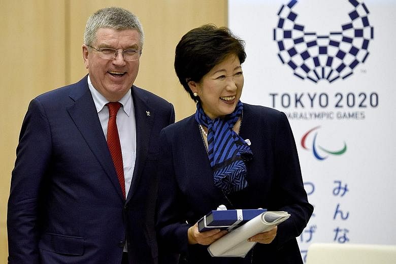 IOC president Thomas Bach and Tokyo Governor Yuriko Koike after their meeting. The German is in Tokyo to look at preparations for the 2020 Olympics, which have been hit by cost over-runs, scrapping of plans for venues and accusations of corruption.
