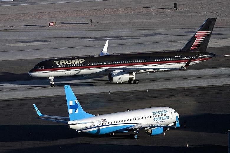 The Trump and Clinton campaign planes at McCarran International Airport in Las Vegas on Tuesday, ahead of today's third and final presidential debate.