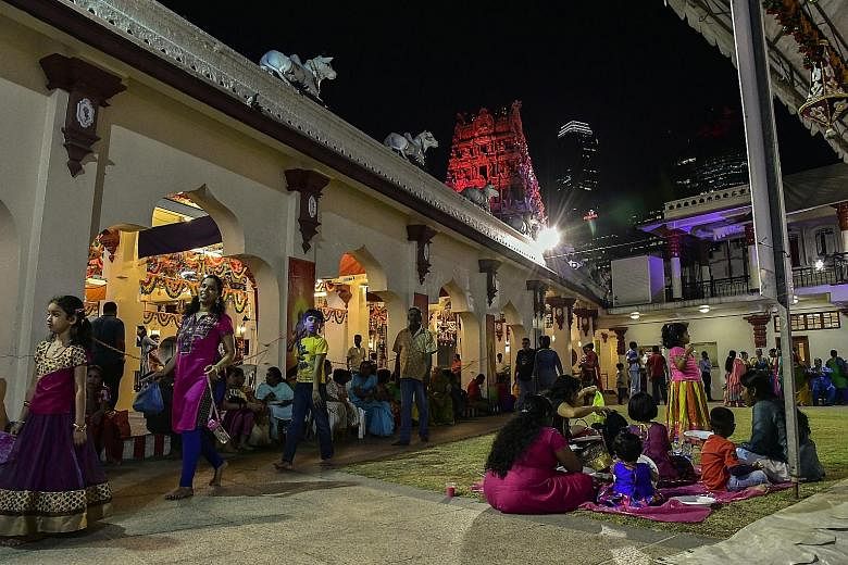 Above: The Sri Mariamman Temple, an enduring icon in Chinatown, has been been gazetted as a national monument. Above: Hindus flock to the temple to offer prayers as well as socialise and watch cultural shows and other events. For example, a nine-day celeb
