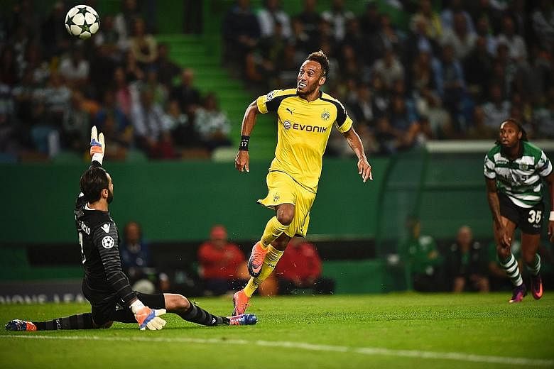 Dortmund forward Pierre-Emerick Aubameyang opens the scoring against Sporting on Tuesday by dinking the ball over goalkeeper Rui Patricio in the ninth minute.