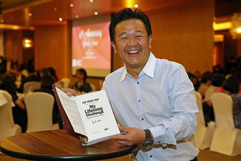 Mr Kwee's winning bid of $11,000 got him a signed copy of Mr Lee Kuan Yew's book My Lifelong Challenge at yesterday's auction.