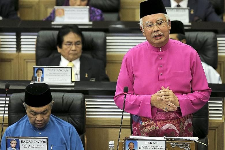 Malaysian Prime Minister Najib Razak presenting the 2017 Budget at Parliament House in Kuala Lumpur yesterday. The opposition has called the giveaways announced in the Budget speech one-off measures and decried the populist spending. Elections, which