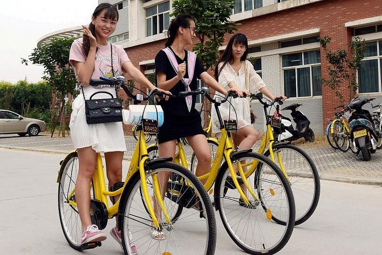 Students using ofo bicycles in Zhengzhou, Henan province. They pay one yuan (20 Singapore cents) per hour for rental. MoBike, on the other hand, charges one yuan for half an hour.