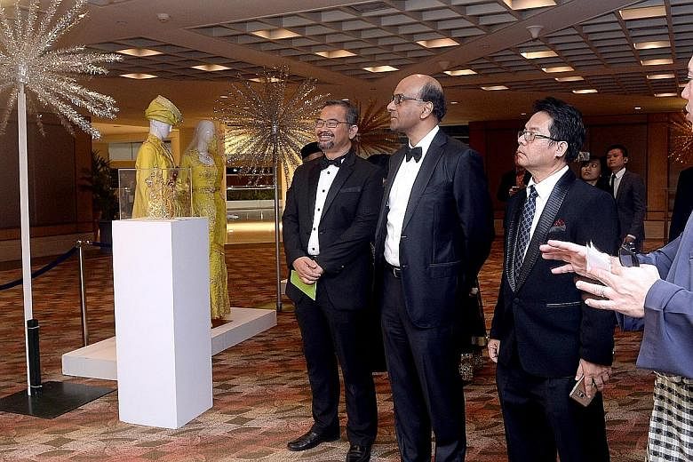 (From left) SMCCI president Zahidi Abdul Rahman, Mr Tharman, gala dinner and awards chairman Abdul Rohim Sarip and wedding entrepreneurs cluster chairman Aziz Mohammad were at the charity gala dinner held by the Singapore Malay Chamber of Commerce an