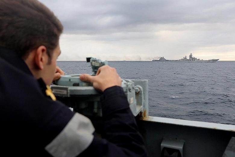 A Royal Navy lookout on the HMS Richmond observing the Russian naval task force on Wednesday in this photograph issued by the British Ministry of Defence. A Royal Navy spokesman described it as the biggest deployment of Russian naval assets seen off 