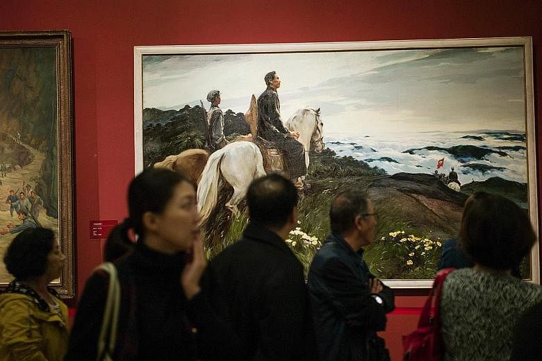 Visitors at the National Museum in Beijing on Oct 12, during an exhibition to mark the 80th anniversary of the Red Army's Long March. According to Communist Party lore, tens of thousands of marchers including Mao Zedong travelled 12,500km through rem