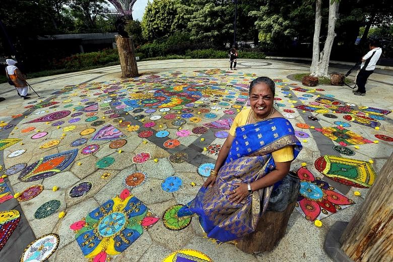 This floor decoration yesterday set a Singapore record for the largest collage made of glass marbles - 15,000 in total. Known as a rangoli, the 10m by 12m artwork at Gardens by the Bay was created by 57-year-old local visual artist Vijaya Mohan, with