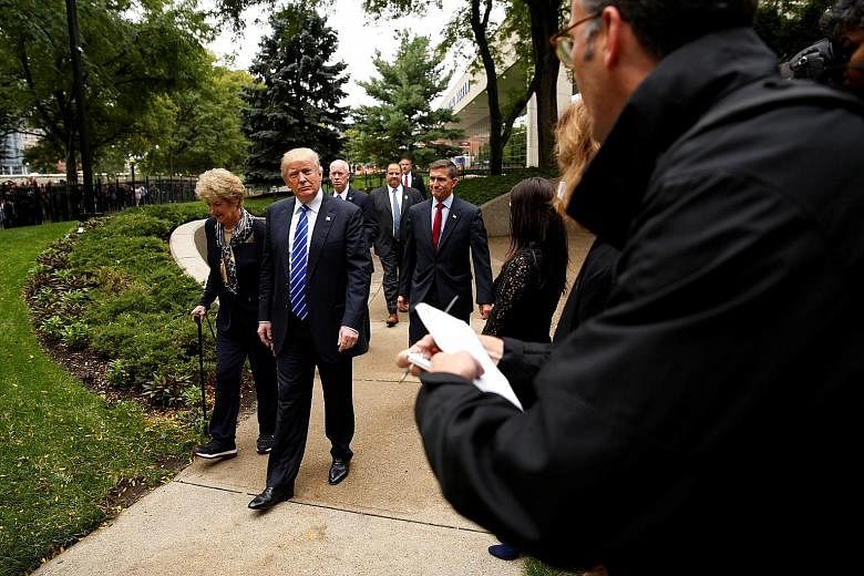 Reporters covering the Trump campaign hovering on the sidelines as the Republican candidate visited the grave of former US president Gerald Ford and his wife, Betty Ford, at the Ford Presidential Museum in Grand Rapids, Michigan, last month. One adva