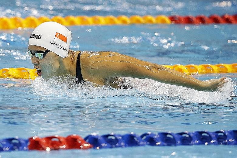 Singapore's Nicholle Toh on her way to third place in the 200m butterfly yesterday. She finished with a time of 2:11.26, which broke the national record of 2:12.45 set by Joscelin Yeo in 2000.