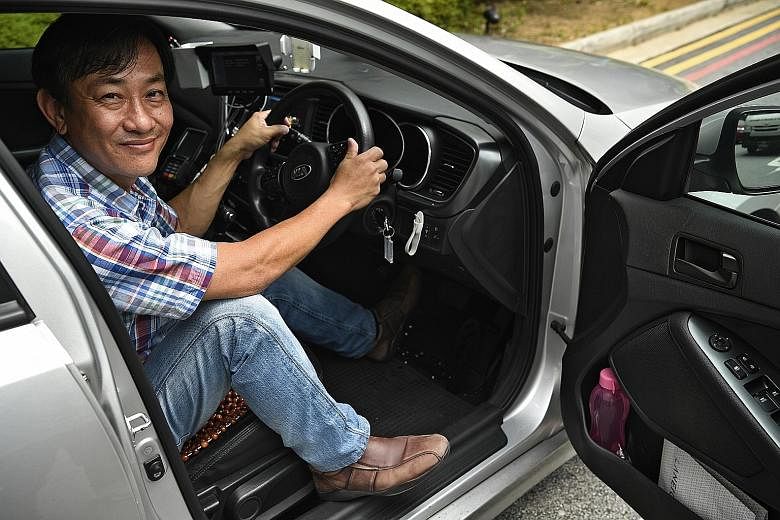 Taxi driver Hong Yong Ming uses a left-foot accelerator to operate the car. He lost control over movements on the right side of his body after a stroke six years ago.