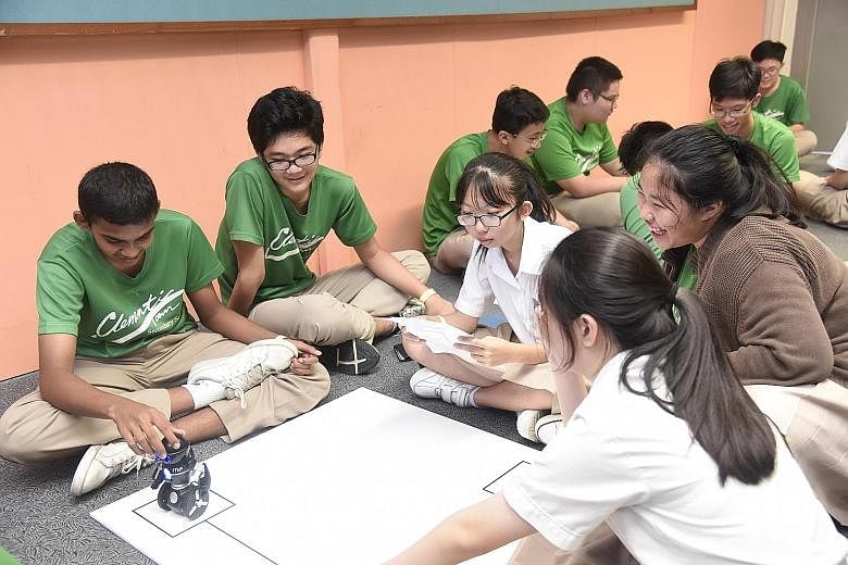 Students from Clementi Secondary School taking part in the robotics workshop, part of this year's Engineering Discovery event. Organised by the five polytechnics, this year's event included for the first time workshops for students to try out project