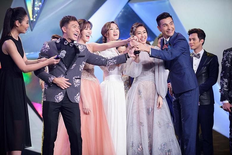 The cast of A Fist Within Four Walls, (from far left) Benjamin Yuen, Moon Lau, Grace Wong, Nancy Wu and Ruco Chan, with the trophy for My Favourite TVB Drama.