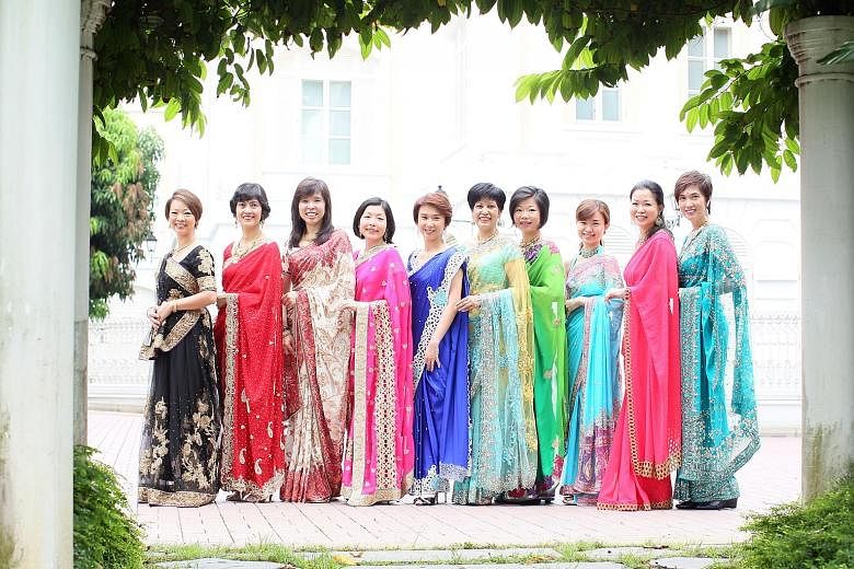 Members of Parliament (from left) Foo Mee Har, Joan Pereira, Jessica Tan, Cheryl Chan, Low Yen Ling, Indranee Rajah, Sim Ann, Tin Pei Ling, Cheng Li Hui and Josephine Teo were among the group of 16 female MPs who wore saris for a Tamil Murasu photo s