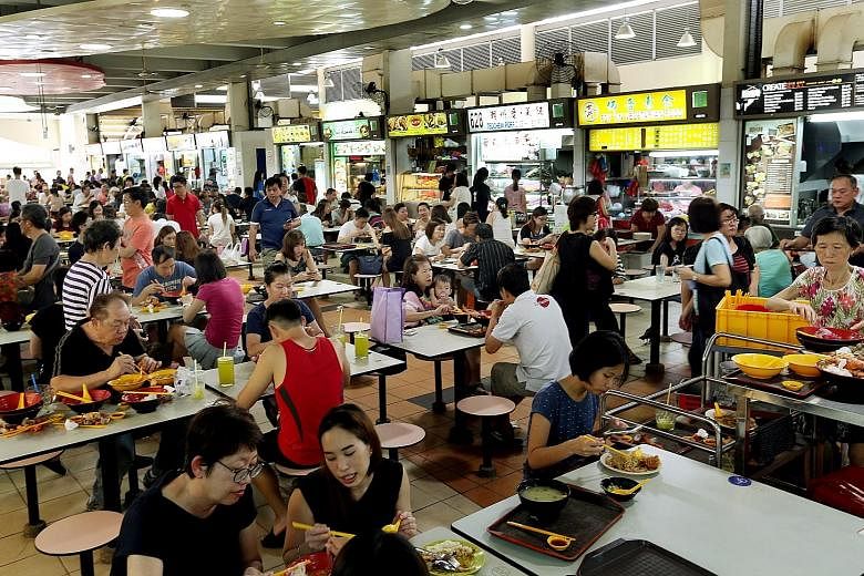 Stallholders at the Ang Mo Kio Block 628 market and food centre (left) who stuck it out through their ordeal, believe there is reason to be optimistic. Business returned, even at a temporary location, and when the new building was completed, it was m