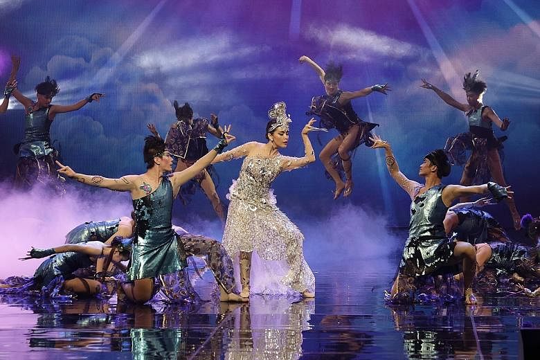 Actress Zoe Tay (centre) performing a peacock-themed dance at the 17th President's Star Charity show last night, which raised a record $7.37 million, nearly $1 million more than last year. Proceeds will go to 58 charities supported by this year's Pre