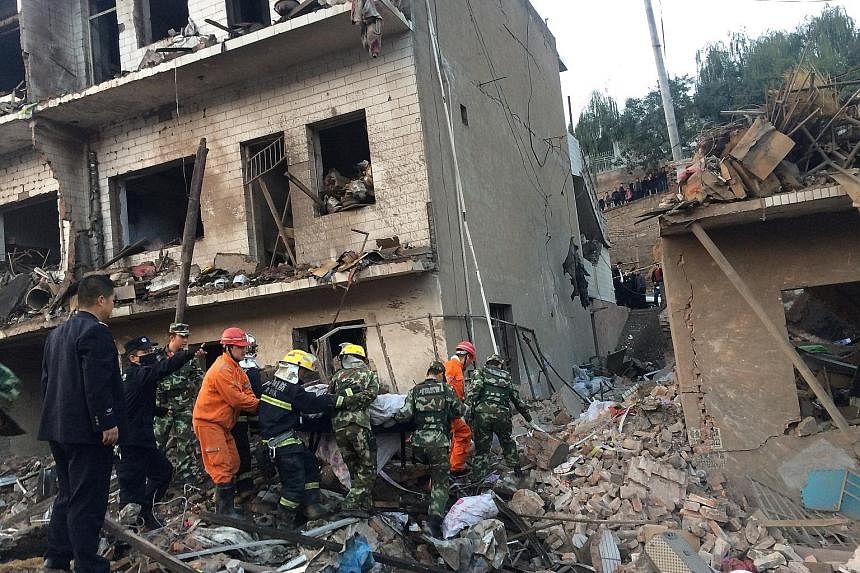 Rescue workers searching for survivors yesterday after an explosion at a prefabricated house in the north-west Chinese province of Shaanxi. At least seven people died and more than 90 were injured, Xinhua news agency reported. The cause of the blast 