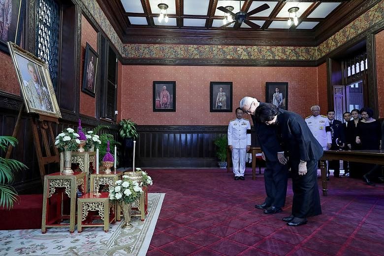 President Tony Tan Keng Yam and wife Mary paying their respects to the late Thai King Bhumibol Adulyadej at the Grand Palace in Bangkok yesterday. In a Facebook post yesterday, Dr Tan wrote that the late monarch was "a close friend of many countries,