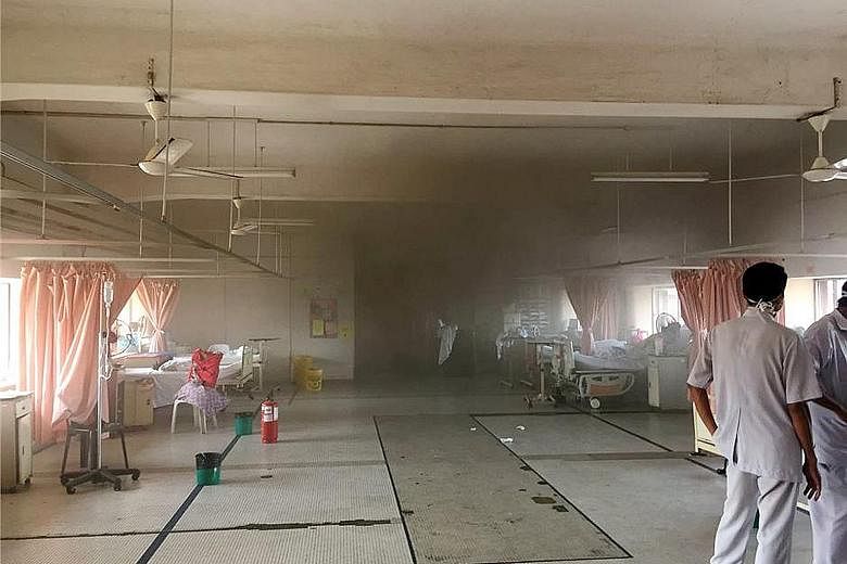 The interior of a hospital building affected by the fire. Some patients are being moved to nearby hospitals, while six victims' bodies are being held at Sultanah Aminah for a post-mortem. Patients being evacuated to other wards after the fire broke o
