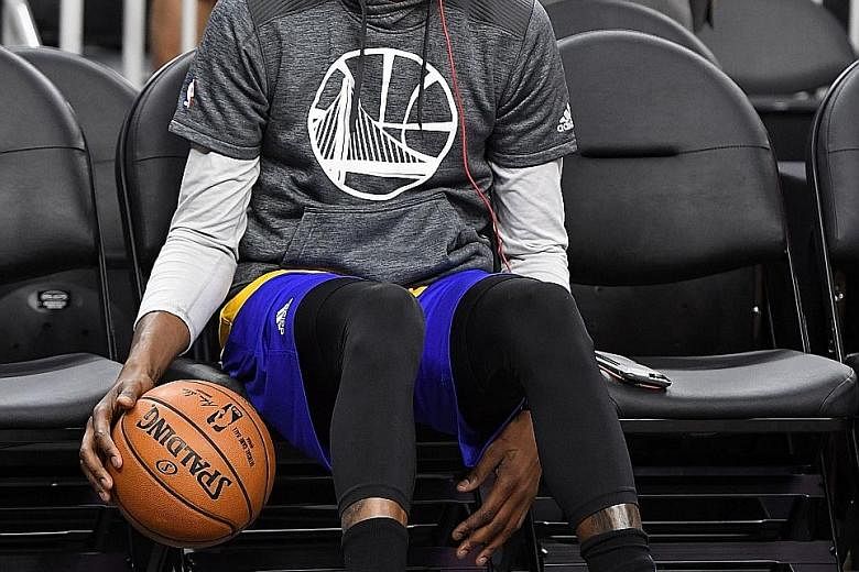 Kevin Durant of the Golden State Warriors perfects his no-look dribbling skills on Oct 15 in Las Vegas. His move after nine seasons as the face of Oklahoma City Thunder was a brave decision.