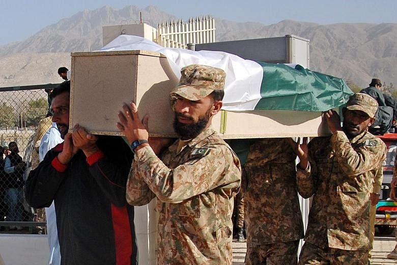 Pakistani soldiers on Tuesday carrying a coffin with the body of one of the cadets who were killed when militants attacked a police academy in Quetta on Monday.
