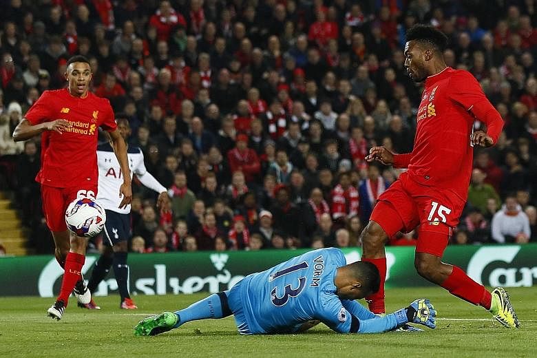 Daniel Sturridge (right) scores the first of his two goals in Liverpool's 2-1 victory against Tottenham Hotspur in the fourth-round League Cup match on Tuesday. Referring to a tackle by Trent Alexander-Arnold (left), Mauricio Pochettino said the Reds