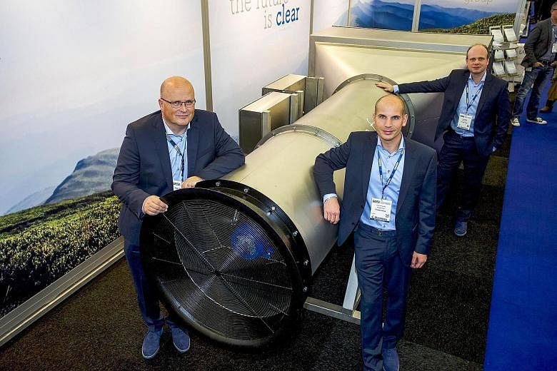 The Envinity Group's managing partners (from left) Peter van Wees, Simon van der Burg and Tim Petter with what they called the world's first giant outside air vacuum cleaner, which is designed to filter fine and ultra-fine particles from ambient air,