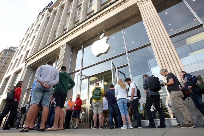 Customers queueing outside an Apple store at the start of iPhone 7 sales in Germany last month. Investors were rattled when Apple said it was caught off guard by how many people wanted to buy the iPhone 7 Plus and the miscalculation may hit profits. 