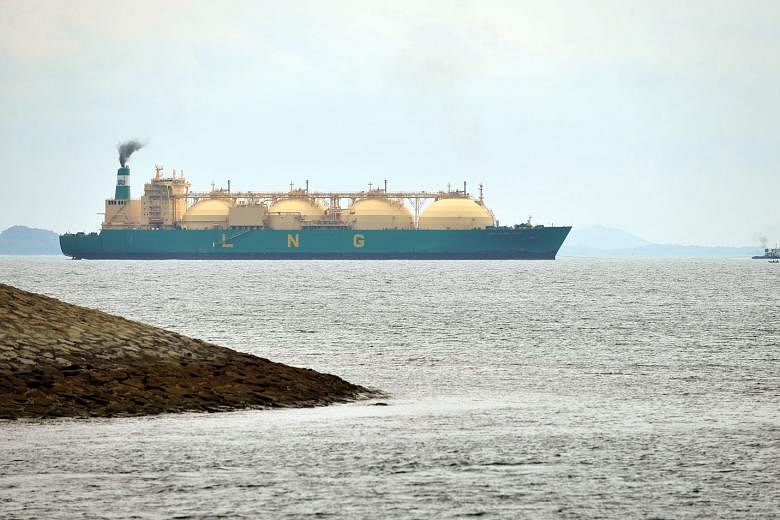 An LNG tanker off the southern coast of Singapore. LNG supplies can now be transported via specially designed ships that can carry the gas in liquefied form, as opposed to the traditional method via pipes.