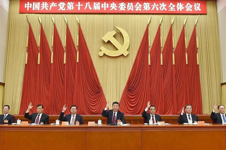 (From left) National People's Congress Standing Committee chairman Zhang Dejiang, President Xi Jinping and Premier Li Keqiang.