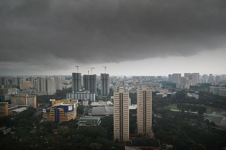 Dark skies over Toa Payoh yesterday afternoon. The wet weather will persist until the end of the month, with more thundery showers in the hours before dawn and in the morning. Most of the rainfall in the first two weeks of this month was due to Sumat