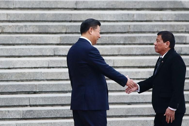 Chinese President Xi Jinping (left) welcoming Mr Duterte in Beijing last week. The Philippines' realignment to China serves to turn Asean centrality on its head, says the writer. 