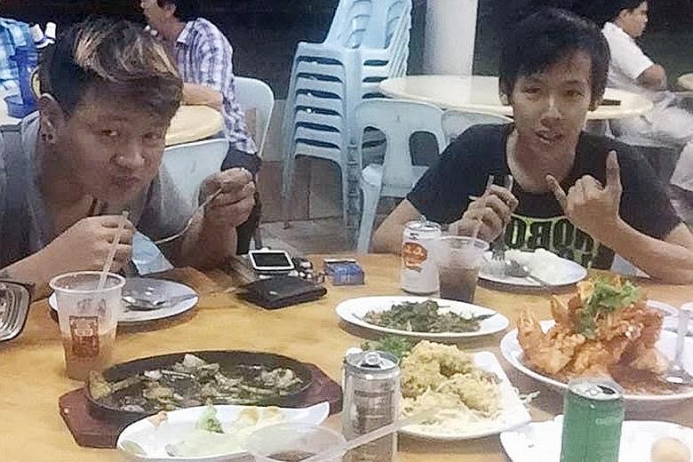 Mr Ong (far left) and Mr Ang having a meal together recently. Friends said the two were cycling in the West Coast area on Thursday because their friend, Marcus, The 34-year-old driver of this trailer truck has been arrested on suspicion of causing de