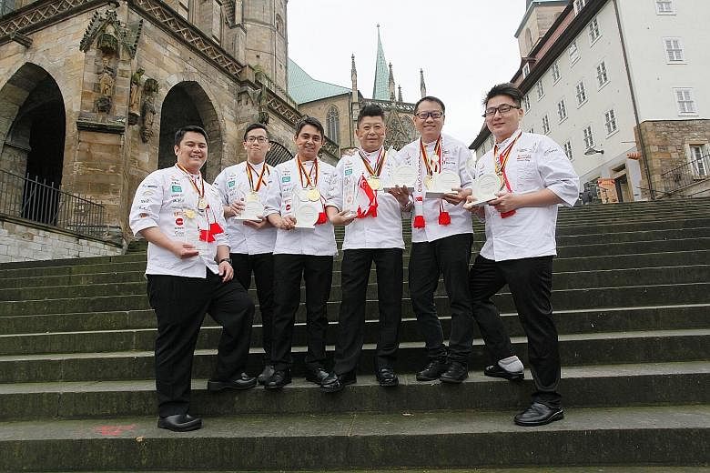 The winning team members: (from left) pastry chef Alex Chong, chef Roy Lim, chef Alan Wong, executive chef Louis Tay, chef Teo Yeow Siang and chef Triston Fang. They beat 29 other teams in Erfurt, Germany, to be the only Asian country to win two gold