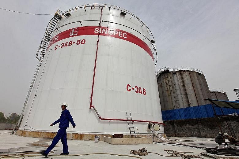 Oil tanks at a Sinopec refinery in Wuhan, Hubei province. Oil's two-year price slide starting in 2014 has been a boon to fuel makers, including Sinopec.
