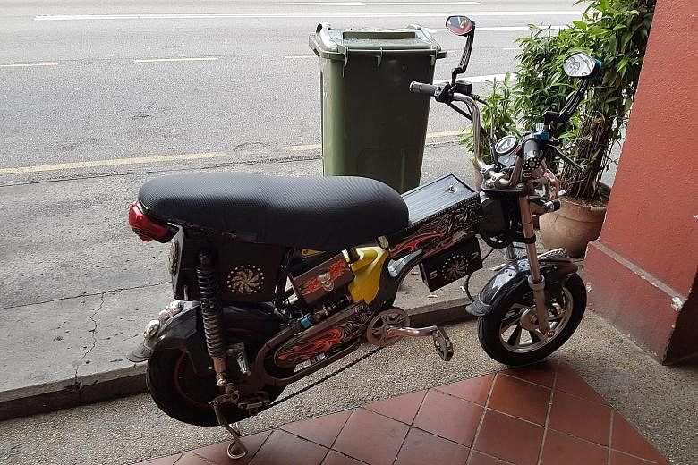 Despite sporting the blue LTA tag - above the bike chain - that identifies it as an approved model, this e-bike seen parked on Geylang Road yesterday has been so heavily modified, it resembles a motorcycle.