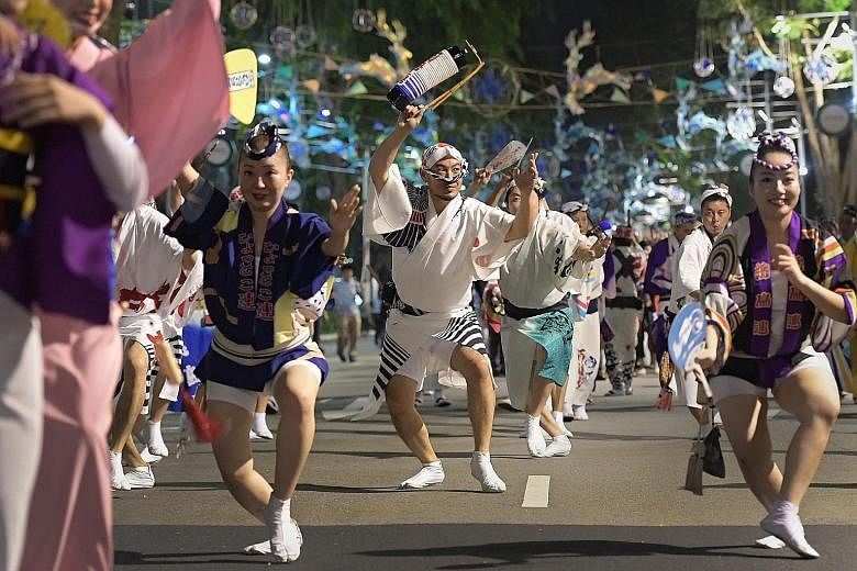 At the parade in Orchard Road, nearly 200 dancers, including top Awa Odori performers (left), entertained the crowds who later joined them.
