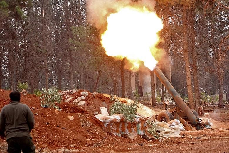 A rebel from the Jaish al-Fatah group on Friday firing a mortar during an assault on Syrian government forces focused on the western edge of Aleppo.