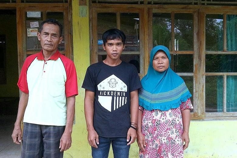 Indonesians Sumarti Ningsih (left) and Seneng Mujiasih were killed by British banker Rurik Jutting in Hong Kong in 2014. Below: Ms Sumarti's brother Suyitno with their parents Achmad Kaliman and Suratmi. The family is hoping justice will be served.