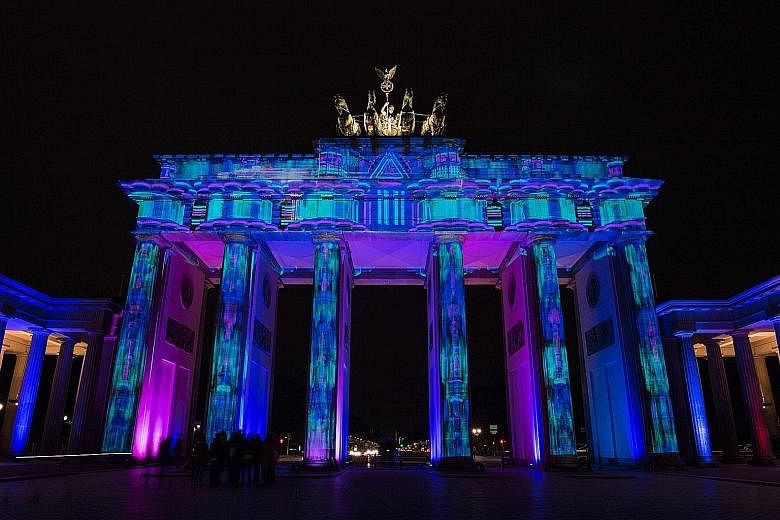 The Brandenburg Gate lit up during the Festival of Lights earlier this month. Berlin's vibrant scene is a draw for tech start-ups.