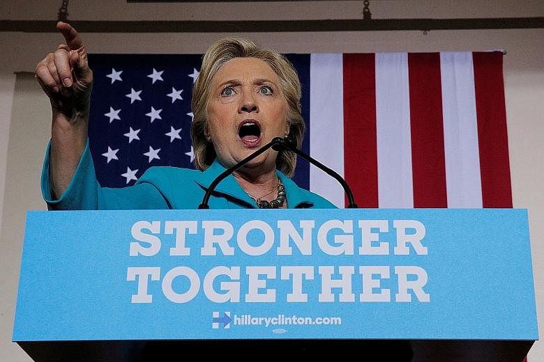 Mrs Clinton at a rally yesterday in Daytona Beach, Florida, where supporters rallied around her, booing as she mentioned the letter sent by FBI director James Comey to Congress last Friday. The day before, the Justice Department strongly discouraged 