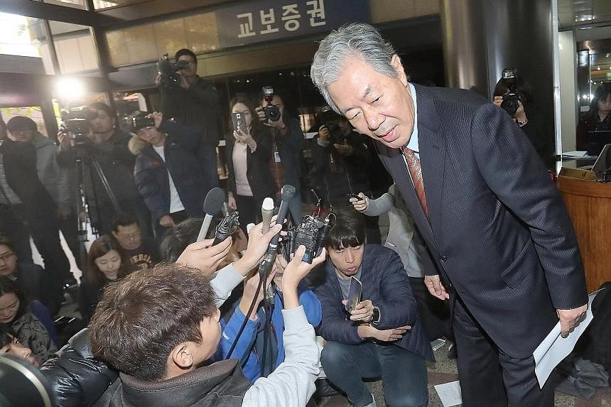 Mr Lee Kyung Jae, lawyer for Ms Choi Soon Sil, leaving after a news conference in Seoul yesterday. He said Ms Choi "expressed her deep apology to the people for letting them down and causing them frustration".